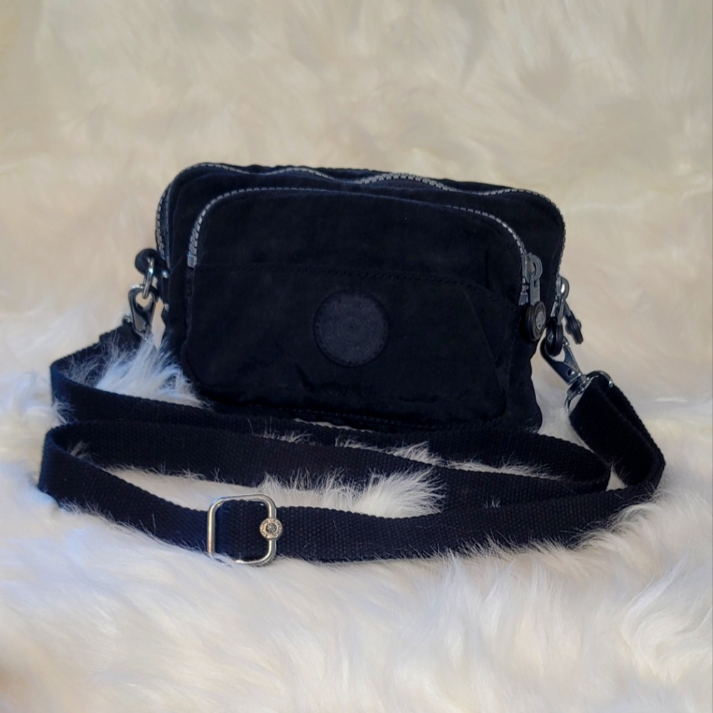 Kipling waist/crossbody. Perfect for travel as very versatile.